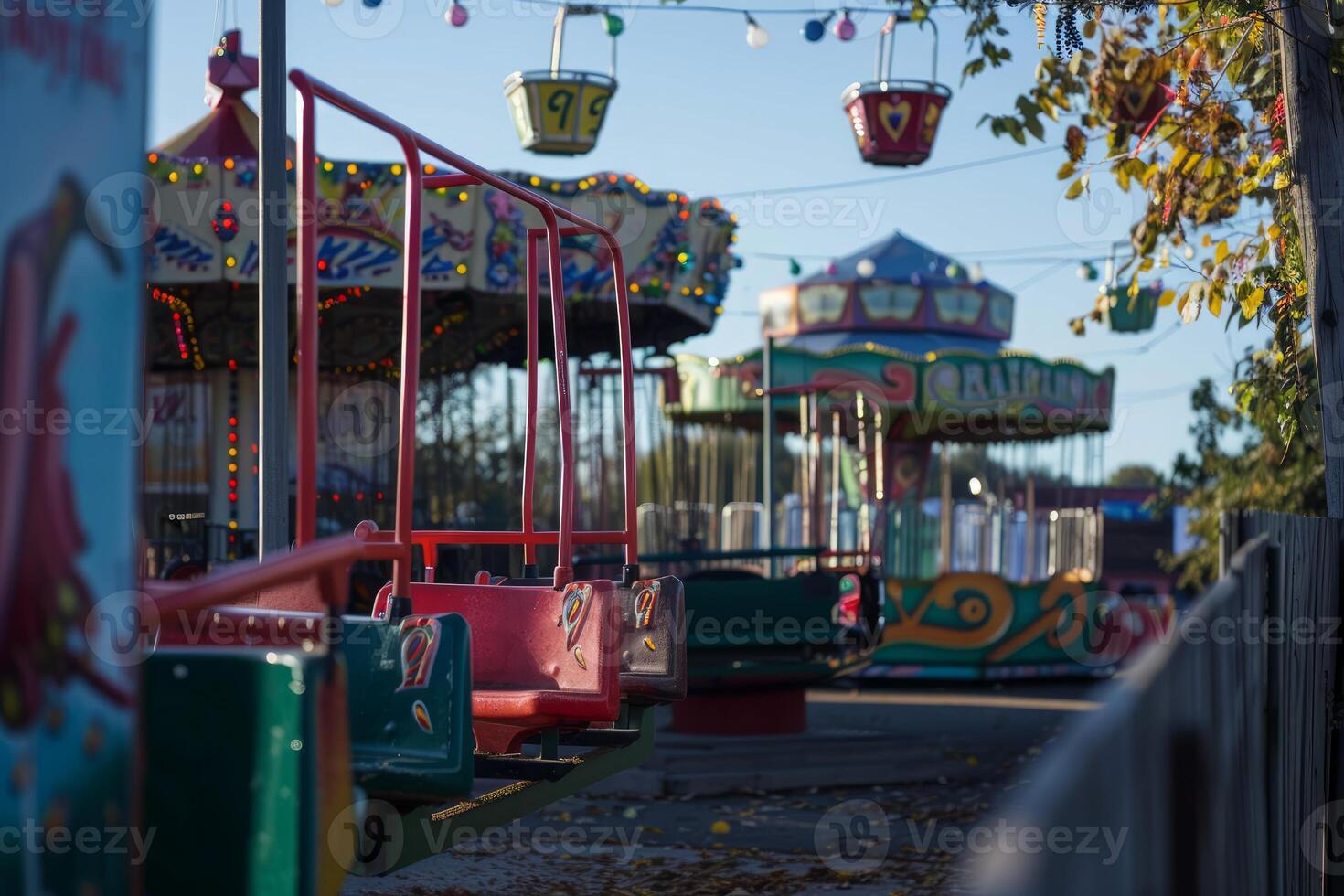 Empty colorful vintage merry go round waiting in amusement park photo