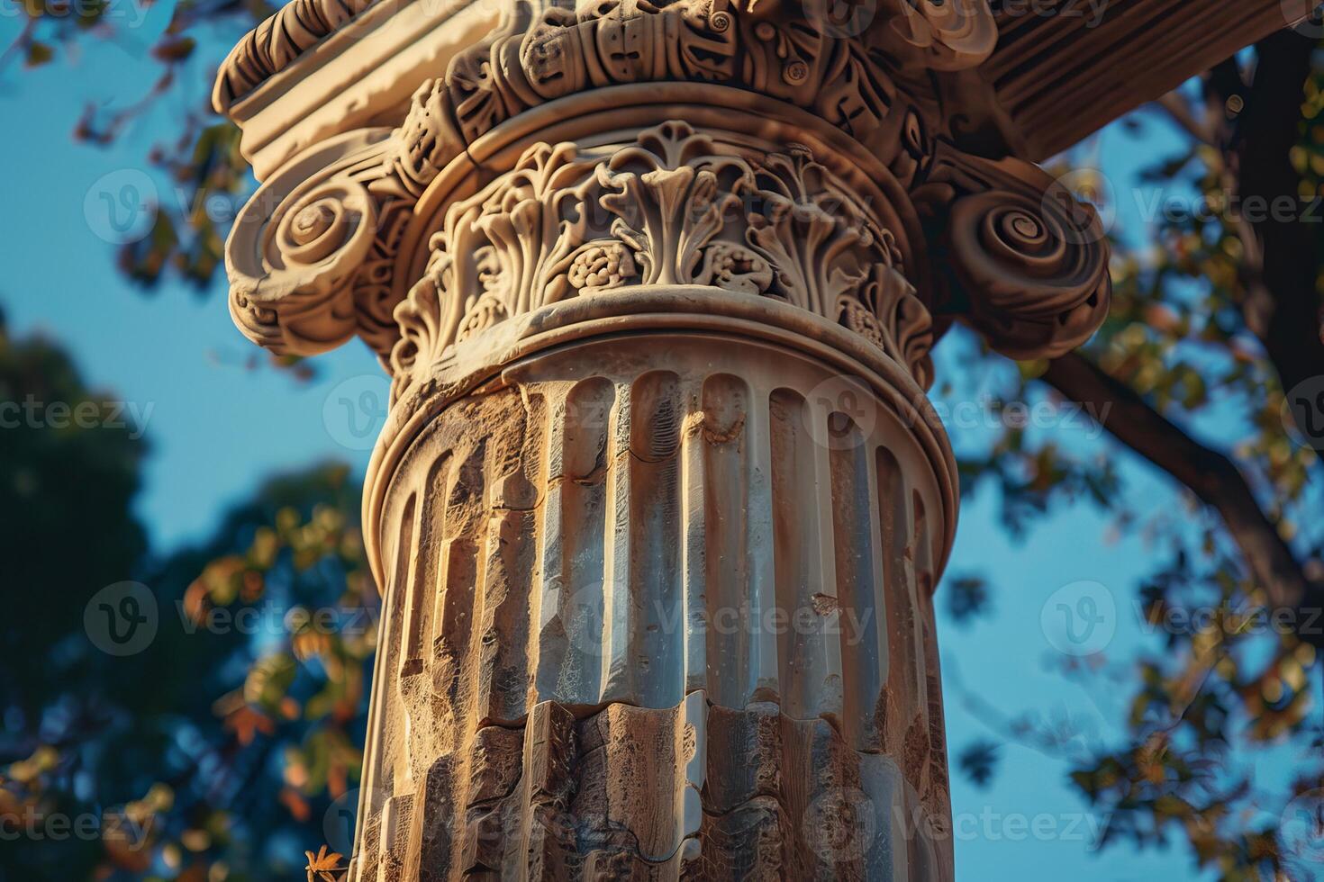 Ancient corinthian column standing tall against blue sky photo