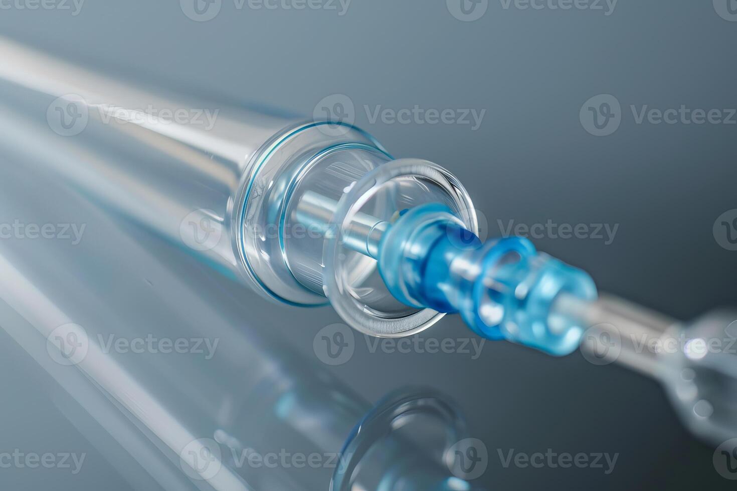 Medical syringe is lying on a reflective surface photo