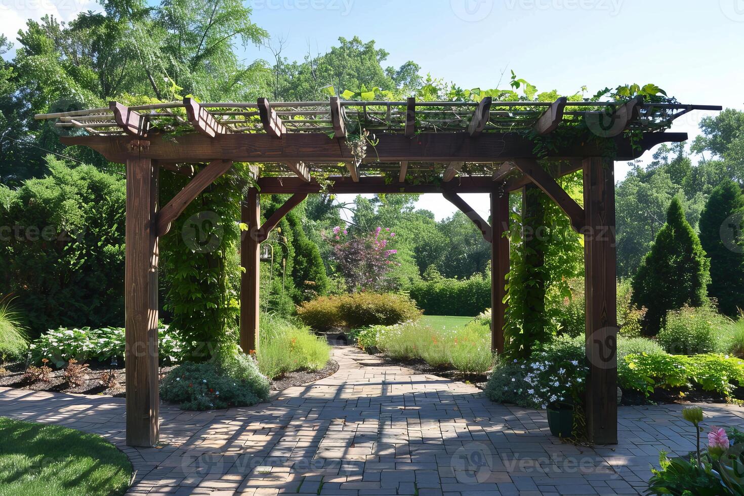 Wooden garden pergola covered with climbing vines leading to backyard garden photo