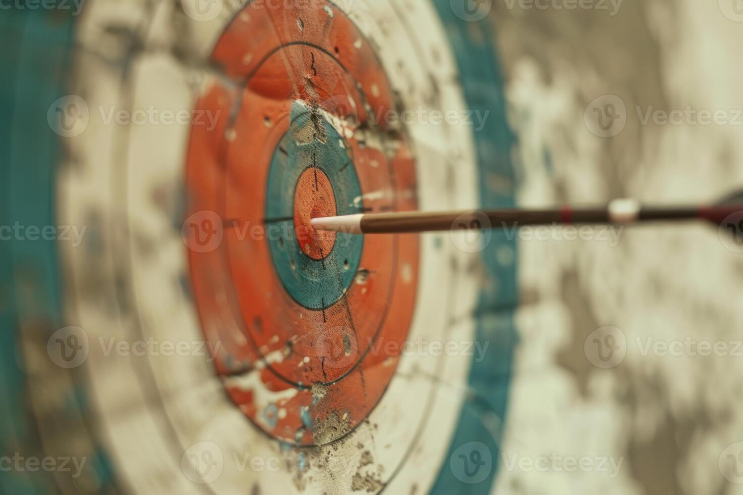 Arrow hitting the center of an archery target photo