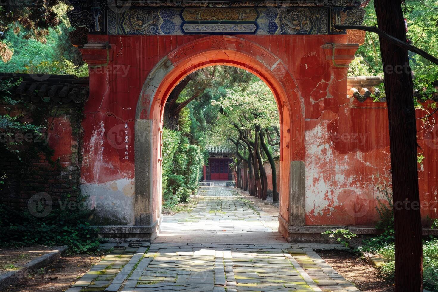 Traditional chinese archway leading to a lush garden photo