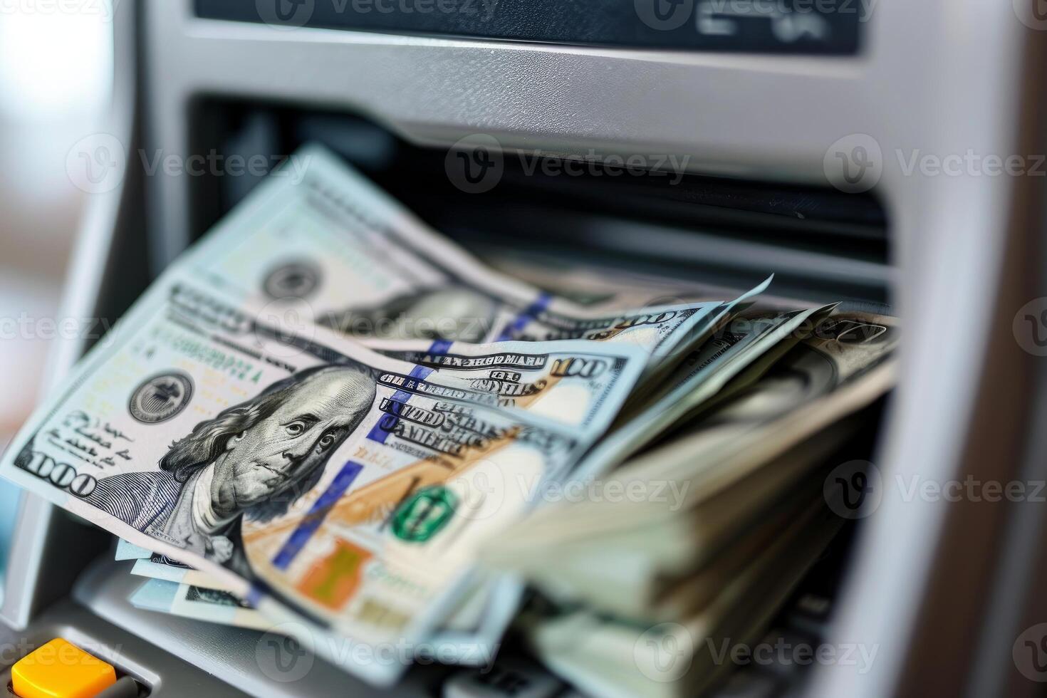 Modern banknote counter processing a stack of one hundred dollar bills photo