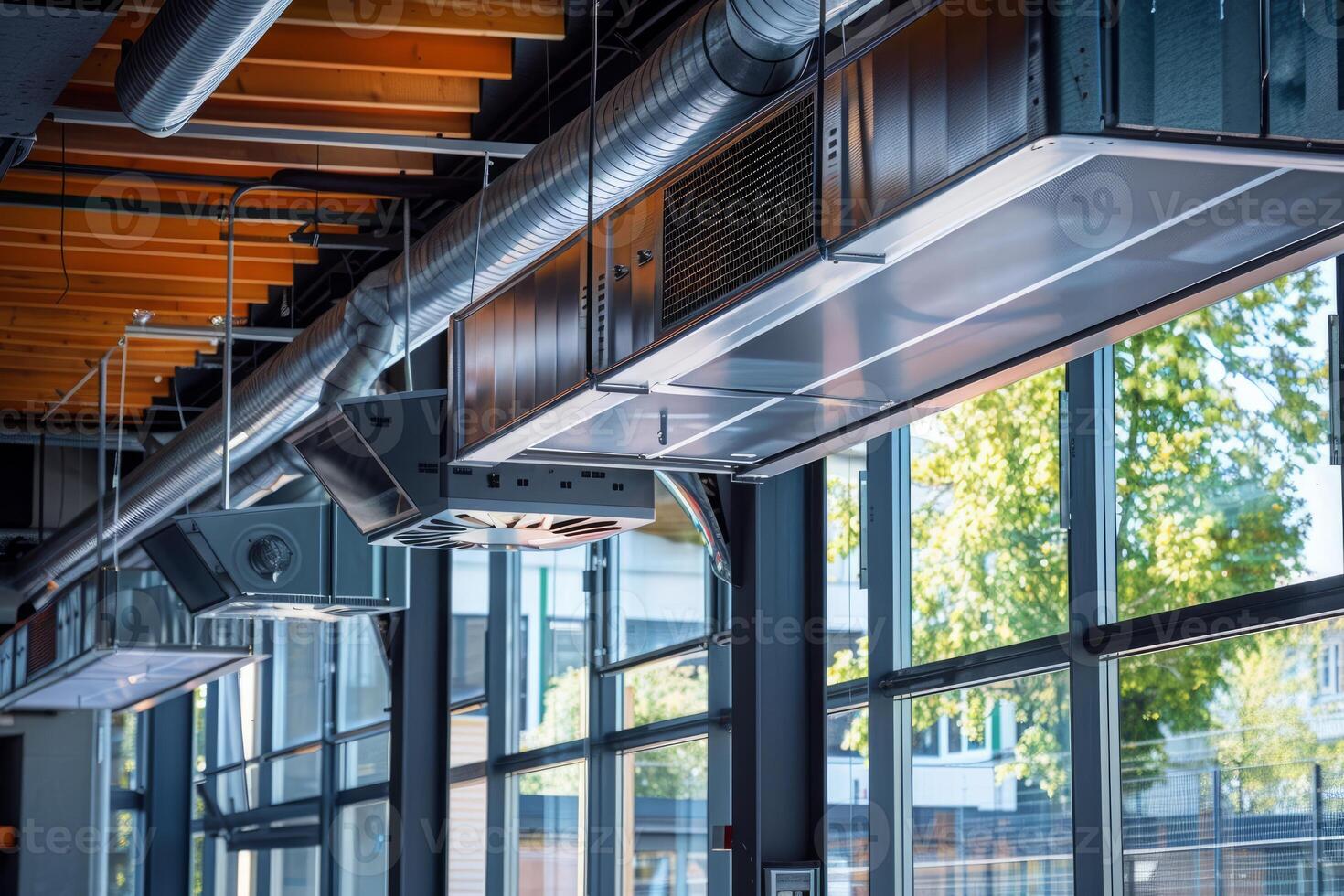 Ventilation system hanging from ceiling in modern building photo