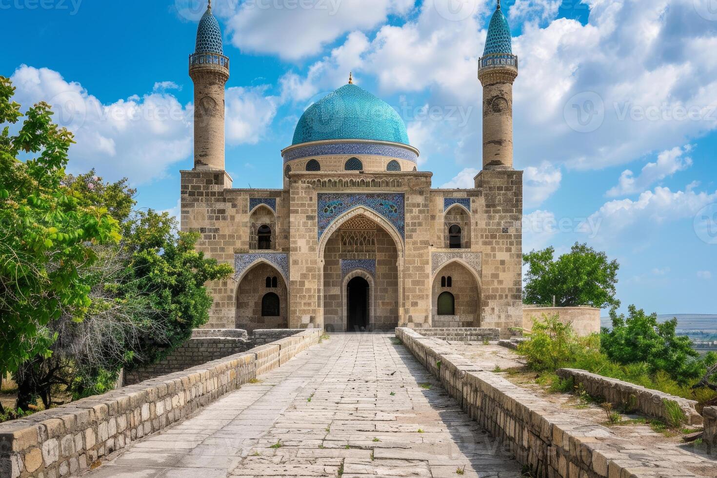 Stone pathway leading to ancient ornate mosque with blue dome in crimea photo
