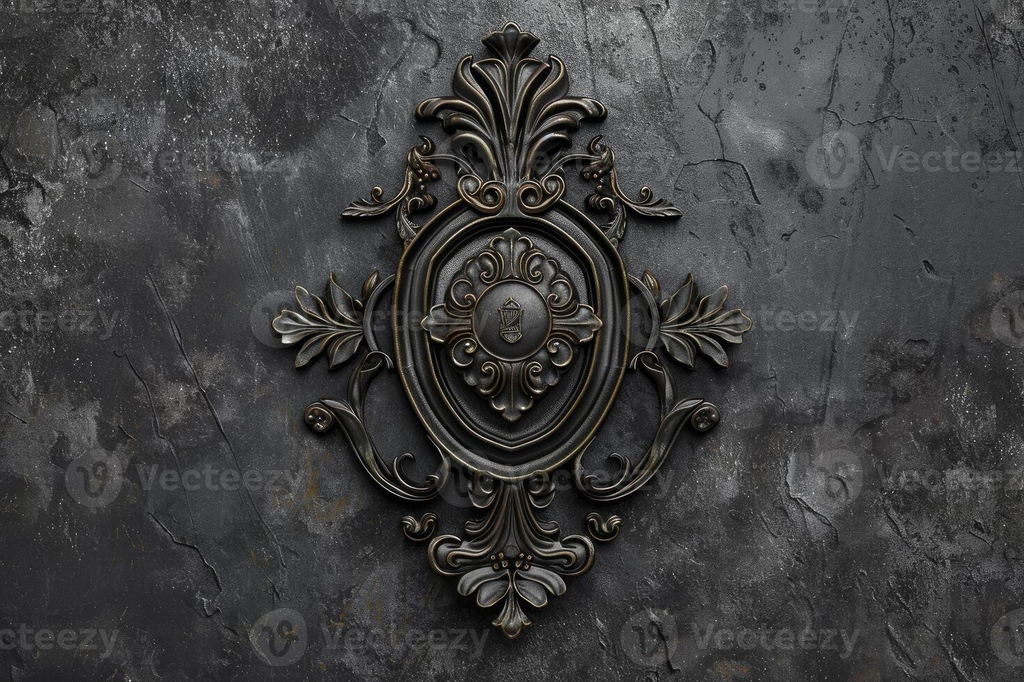 Black vintage ornament lying on dark concrete background photo