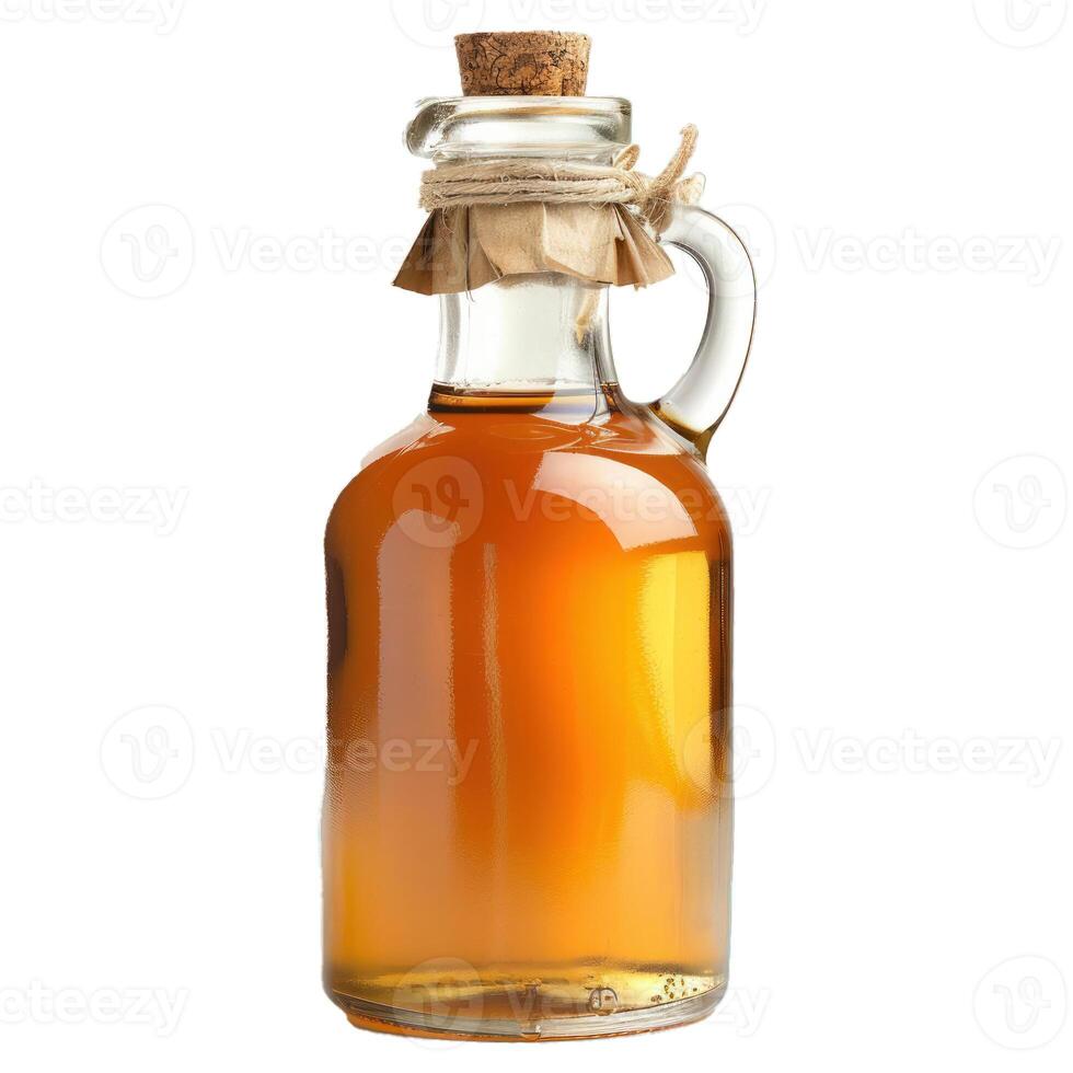 Glass bottle containing light amber liquid with cork stopper photo