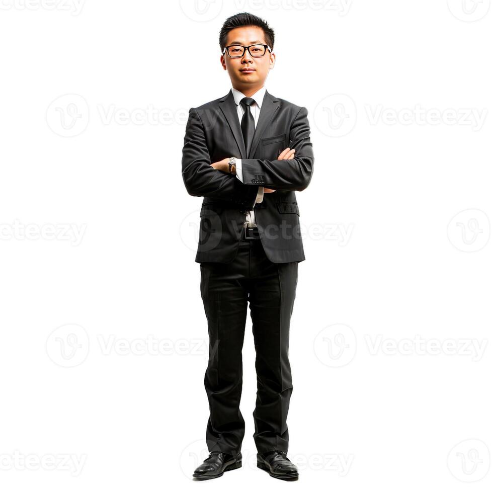 Serious young businessman standing with arms crossed photo
