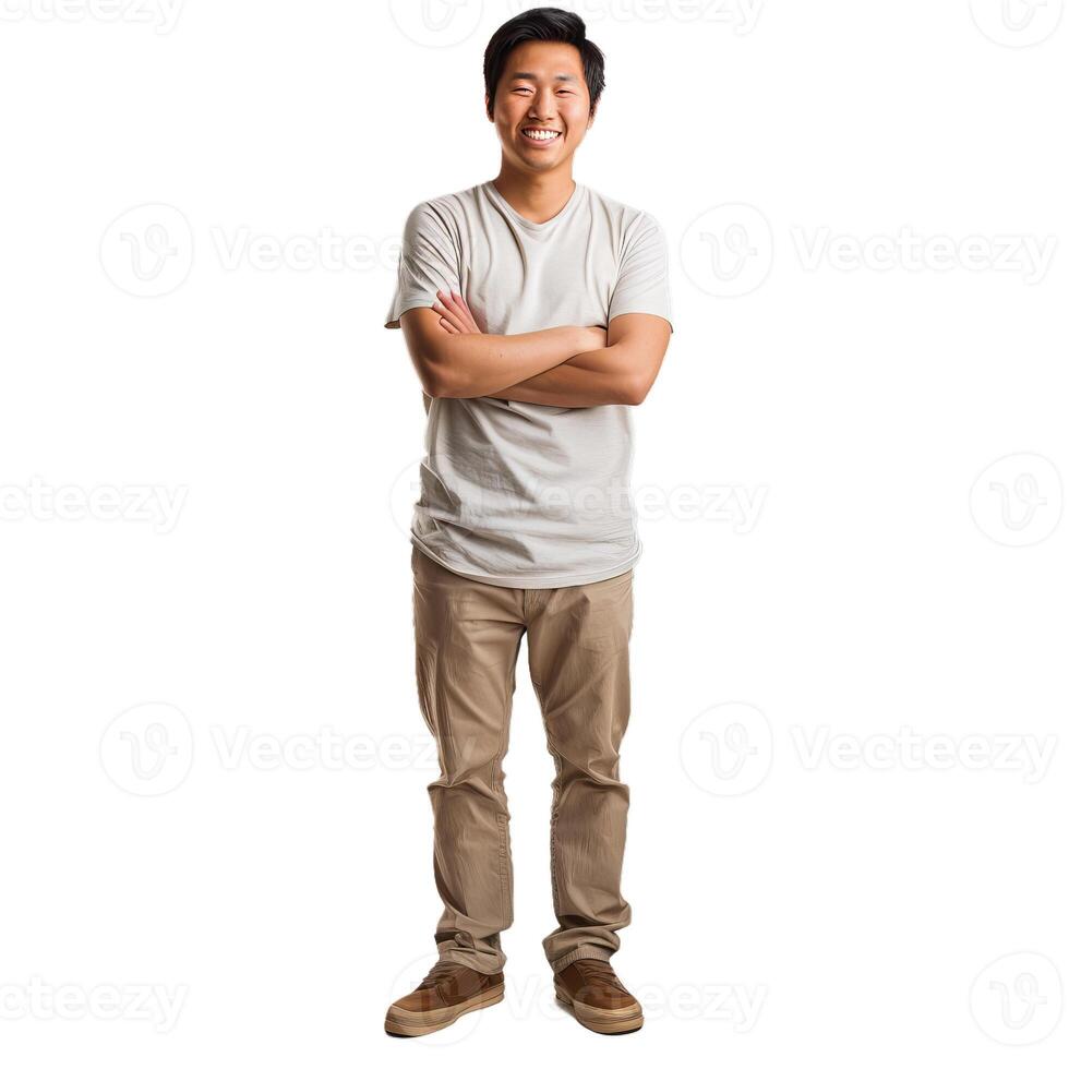 Young asian man standing with folded arms smiling at camera photo