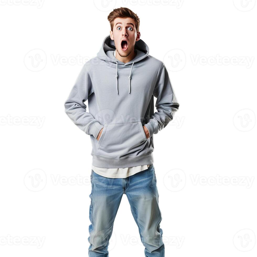 Shocked young man looking surprised with hands in pockets photo