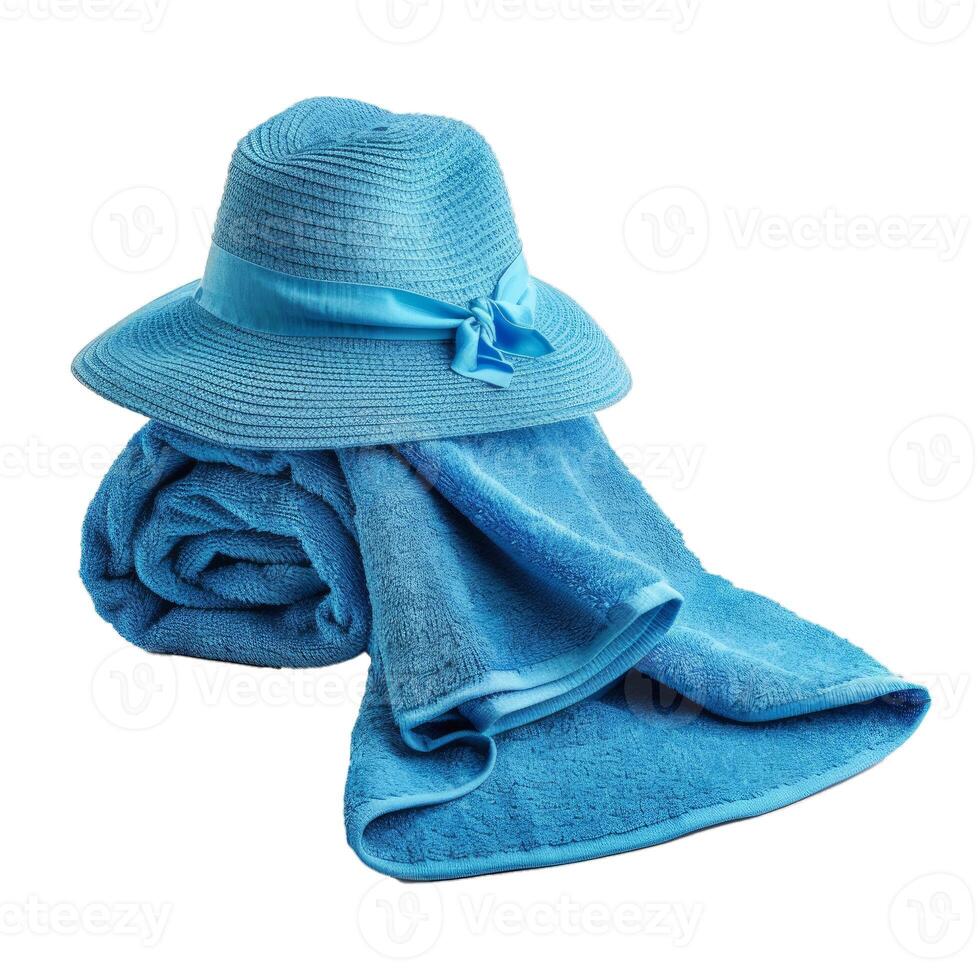 Blue beach towel with a straw hat on a white background photo
