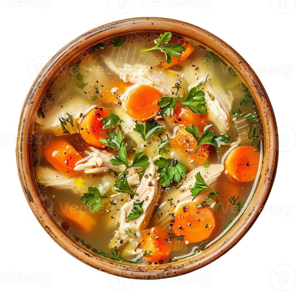 Steaming hot chicken soup with carrots and herbs in bowl photo