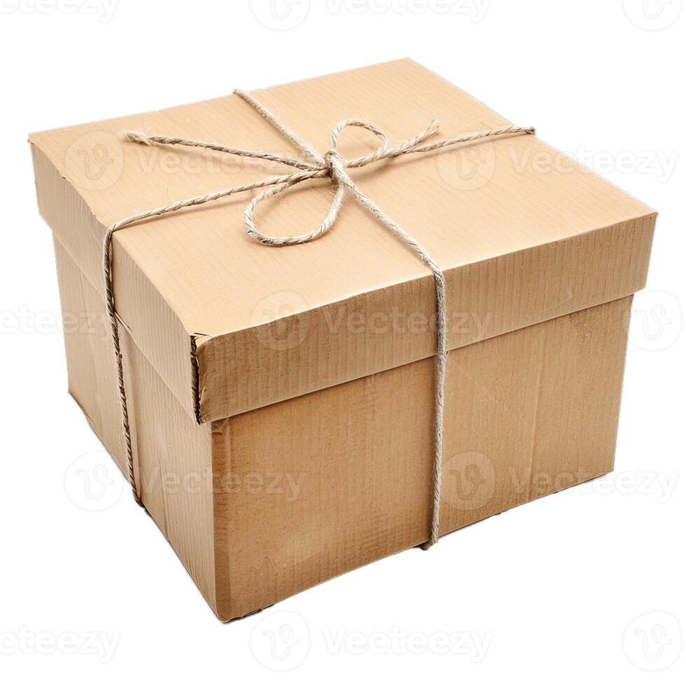 Cardboard box tied with string on white background photo