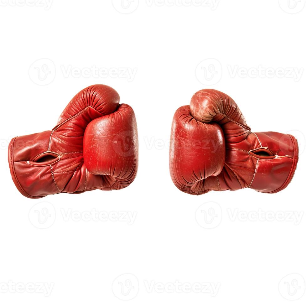 Pair of worn red leather boxing gloves facing each other on white background photo