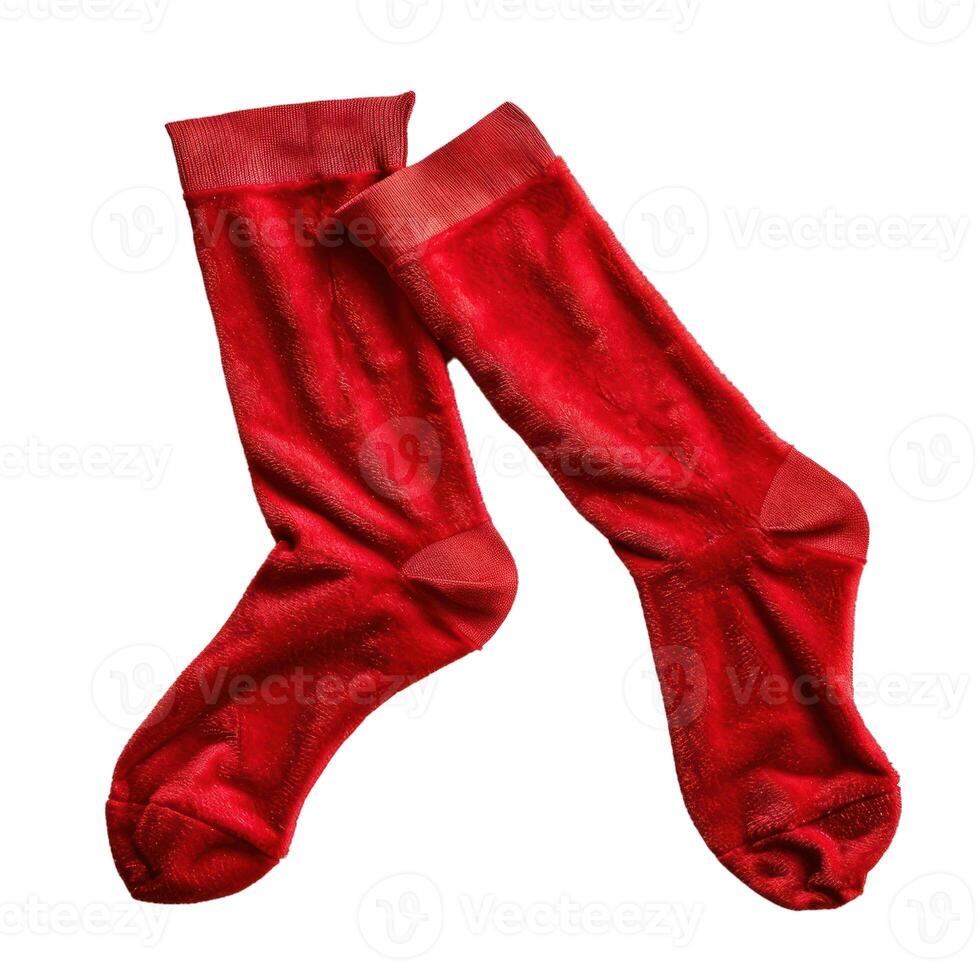 Pair of red fluffy socks lying on white background photo
