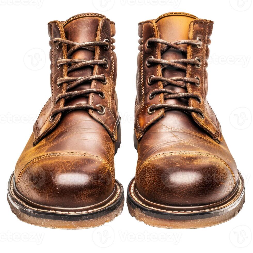 Pair of brown leather working boots standing at attention photo