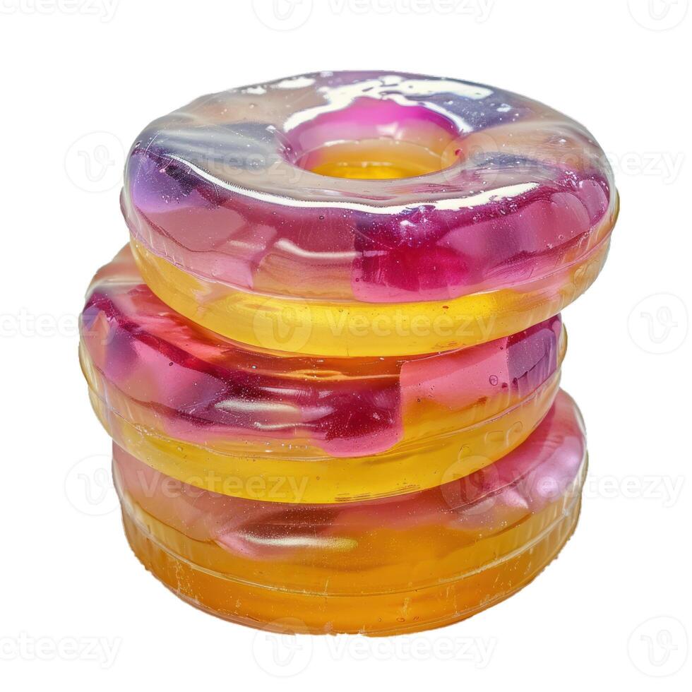 Three colorful round candies making a small tower isolated on white background photo