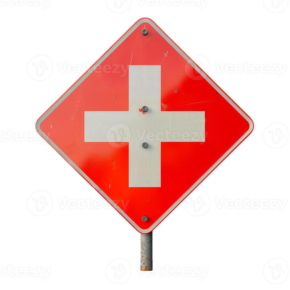 Red and white crossroads traffic sign warning of upcoming intersection photo