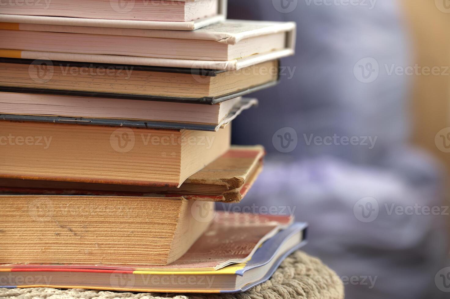 Stack of various books symbolizing knowledge, education, and wisdom photo