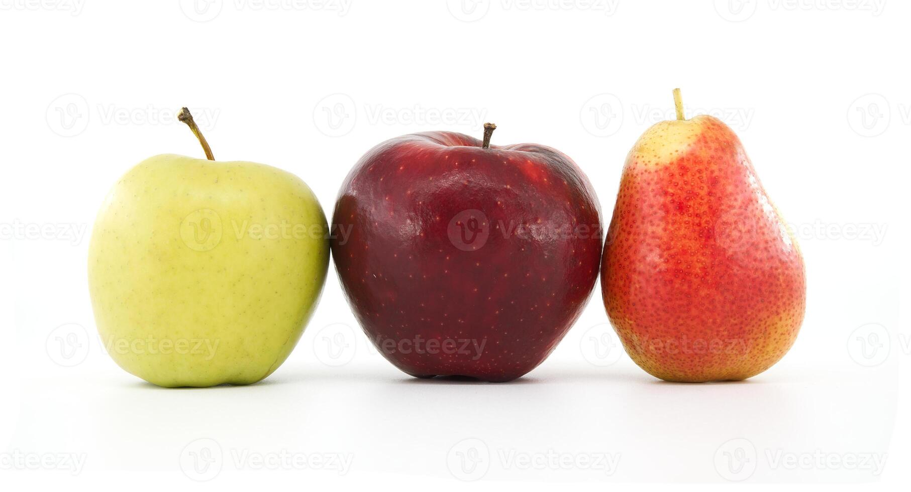 Red apple, green apple, and pear fruit trio on white background photo