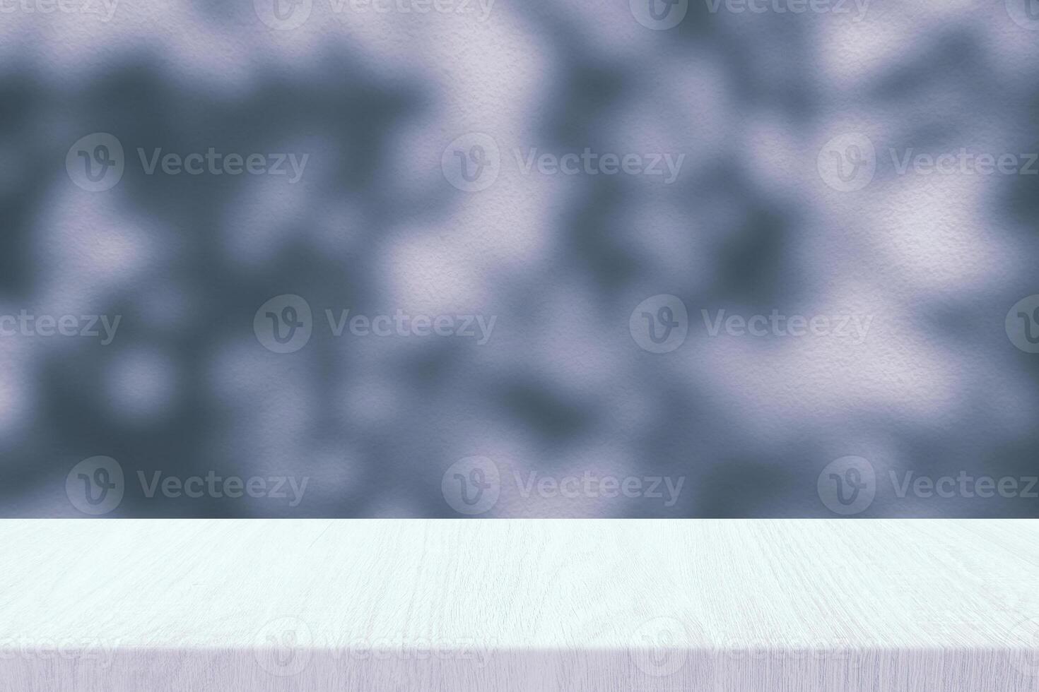 Wood Table with Scary Tree Shadow on Concrete Wall Texture Background in Dark Shade of Cyan blue photo