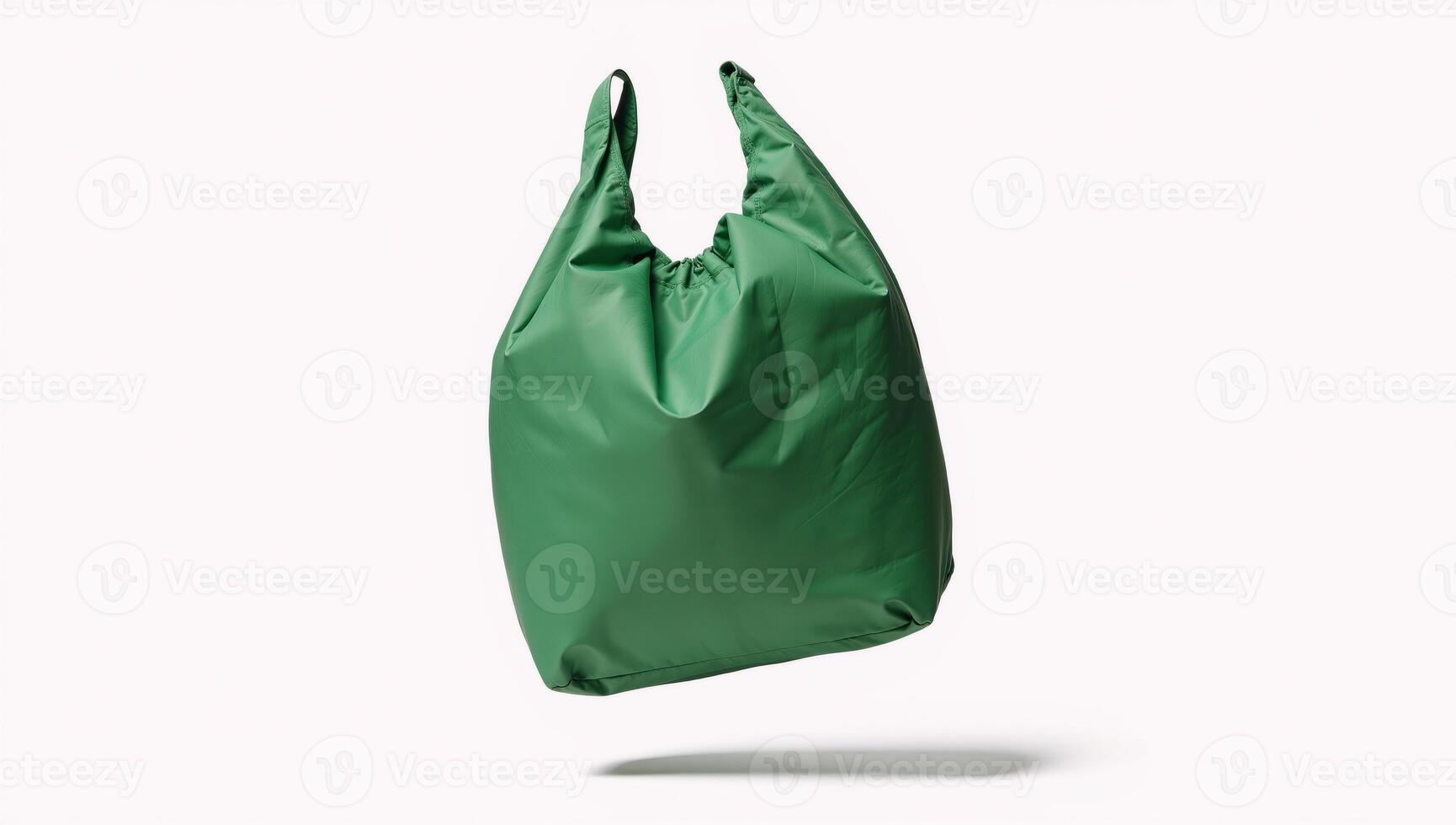 Isolated green nylon bag flying against white background clipping path photo
