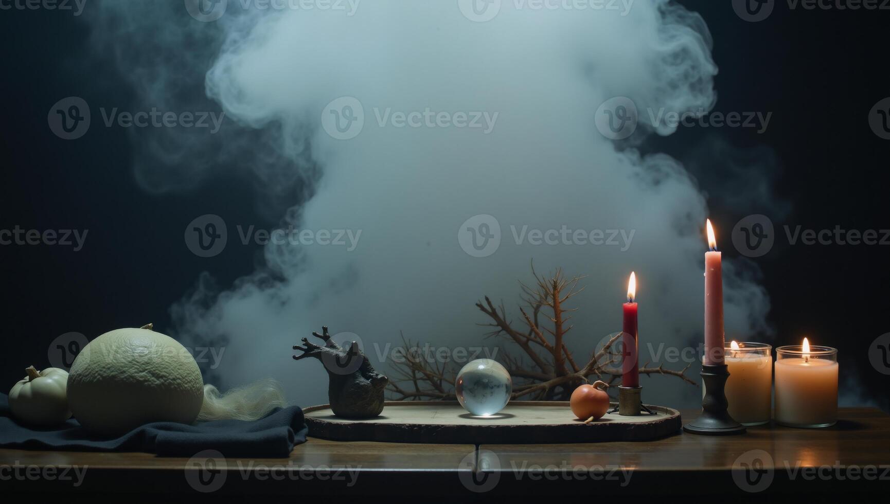 Foggy dark setting with smoke and mist on wooden table against an abstract and defocused Halloween backdrop photo