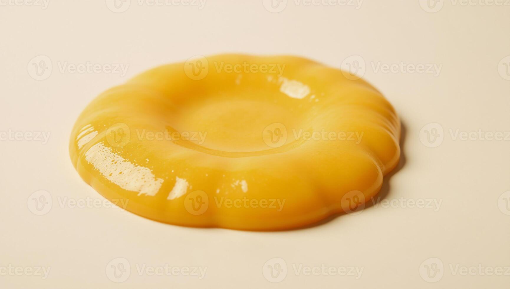 Melted cheese puddle with glossy texture against white backdrop YellowOrange Cheese photo