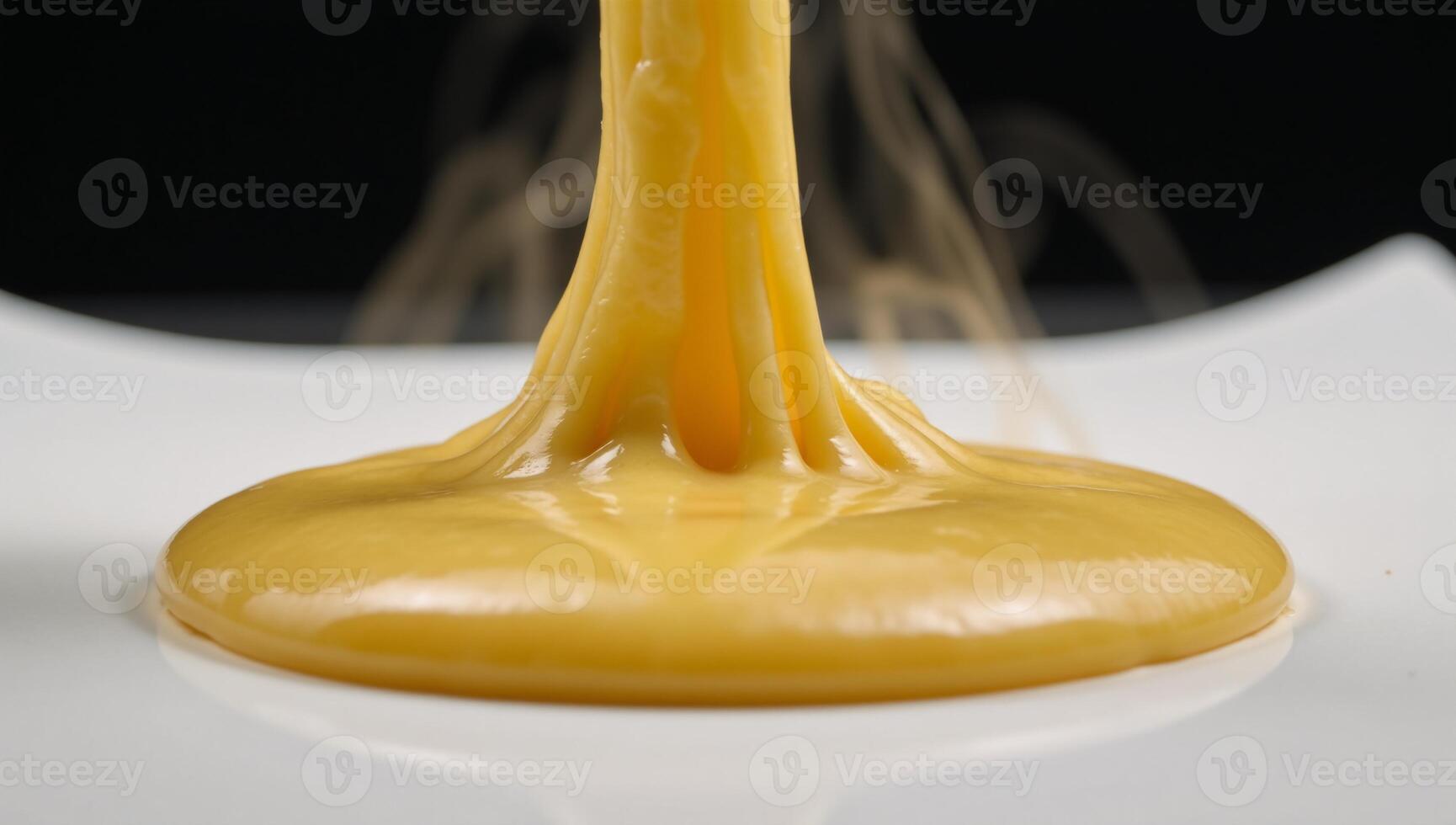 Melted cheese burst with flavorful splashes photo