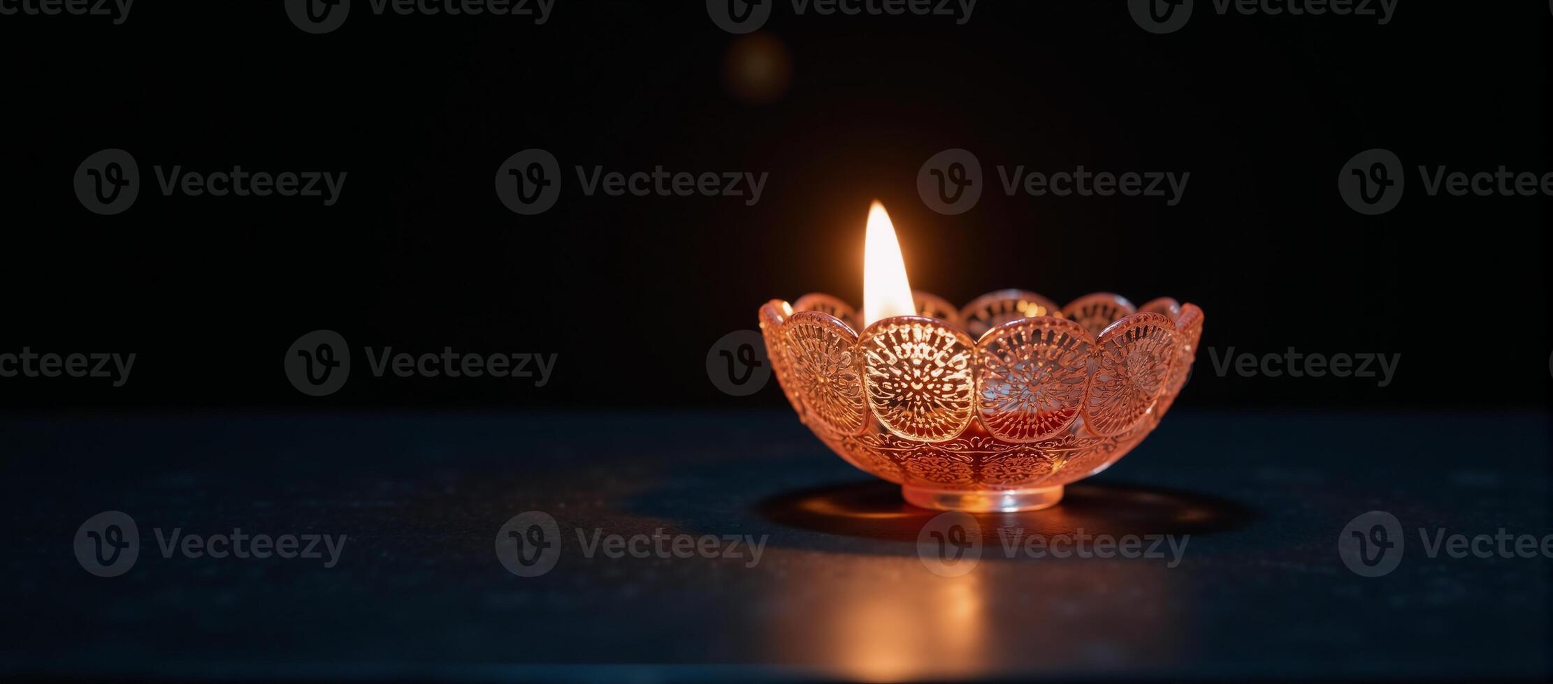 Diwali diya oil lamp isolated against the backdrop of the Festival of Lights photo