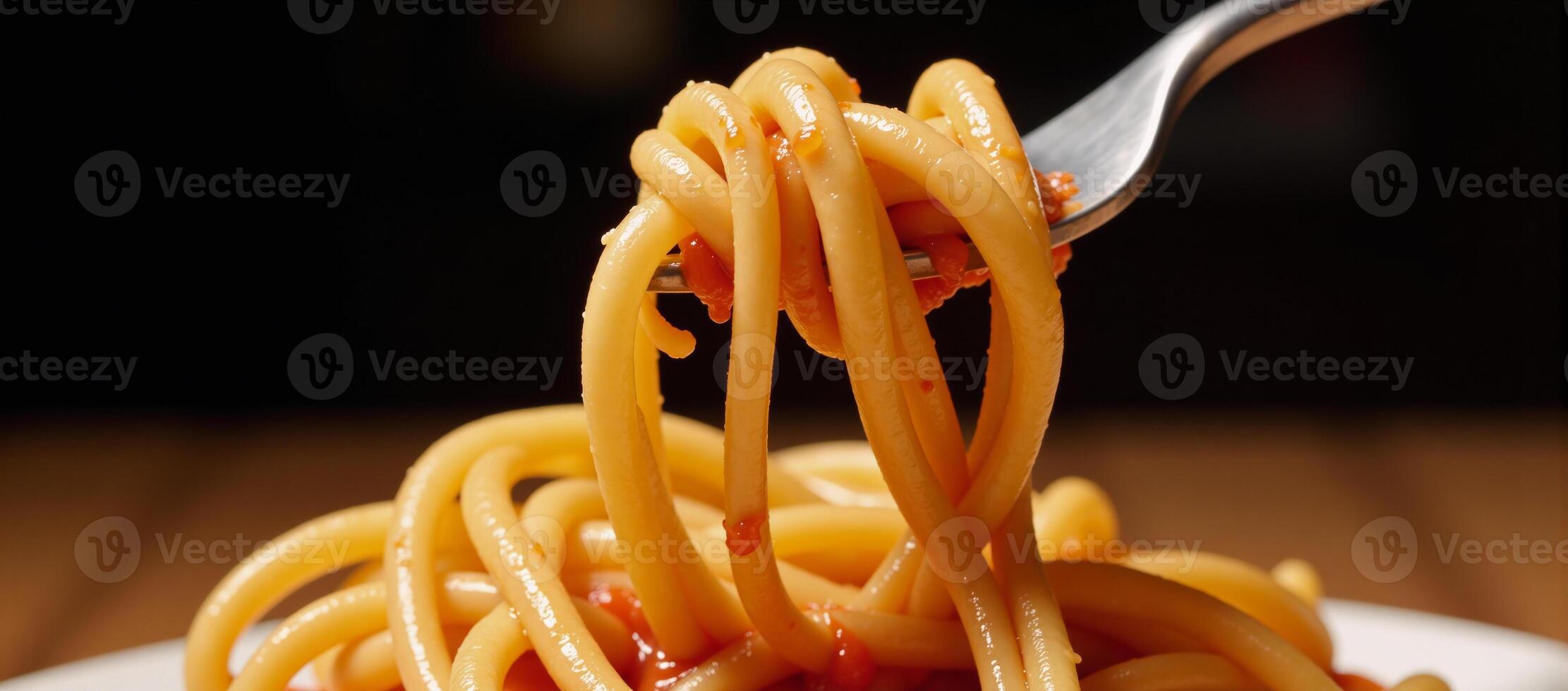 Tornadolike spiral of twirling pasta with tomato sauce splashes photo