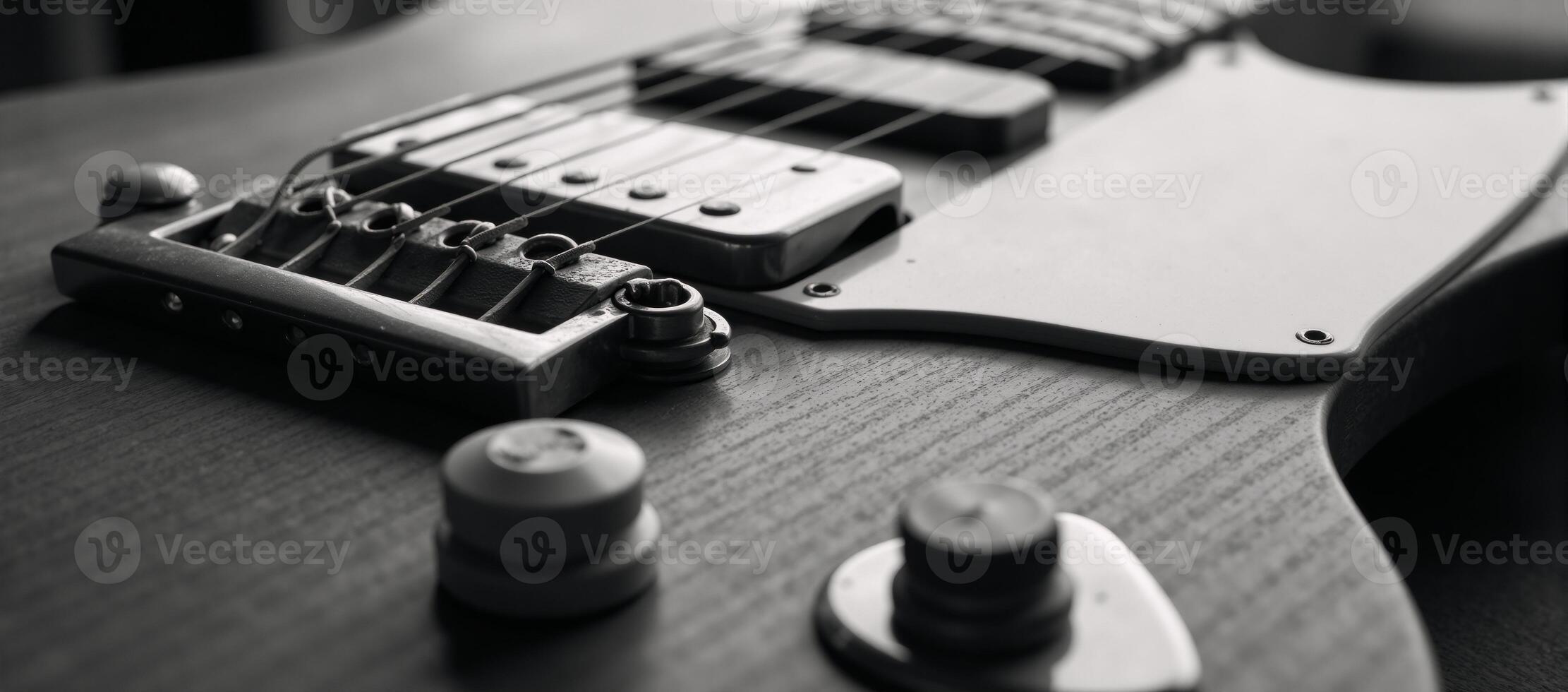 Blackandwhite closeup portrait of a classic vintage electric guitar with ample negative space photo