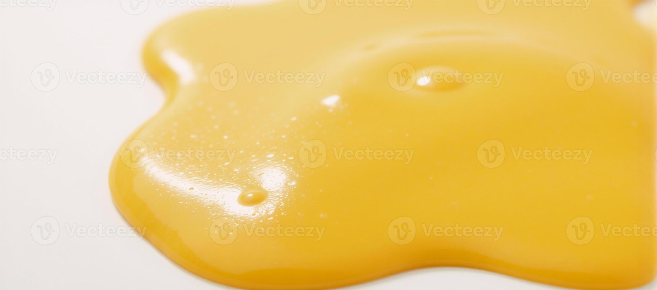 Melted cheese puddle with glossy texture against white backdrop YellowOrange Cheese photo