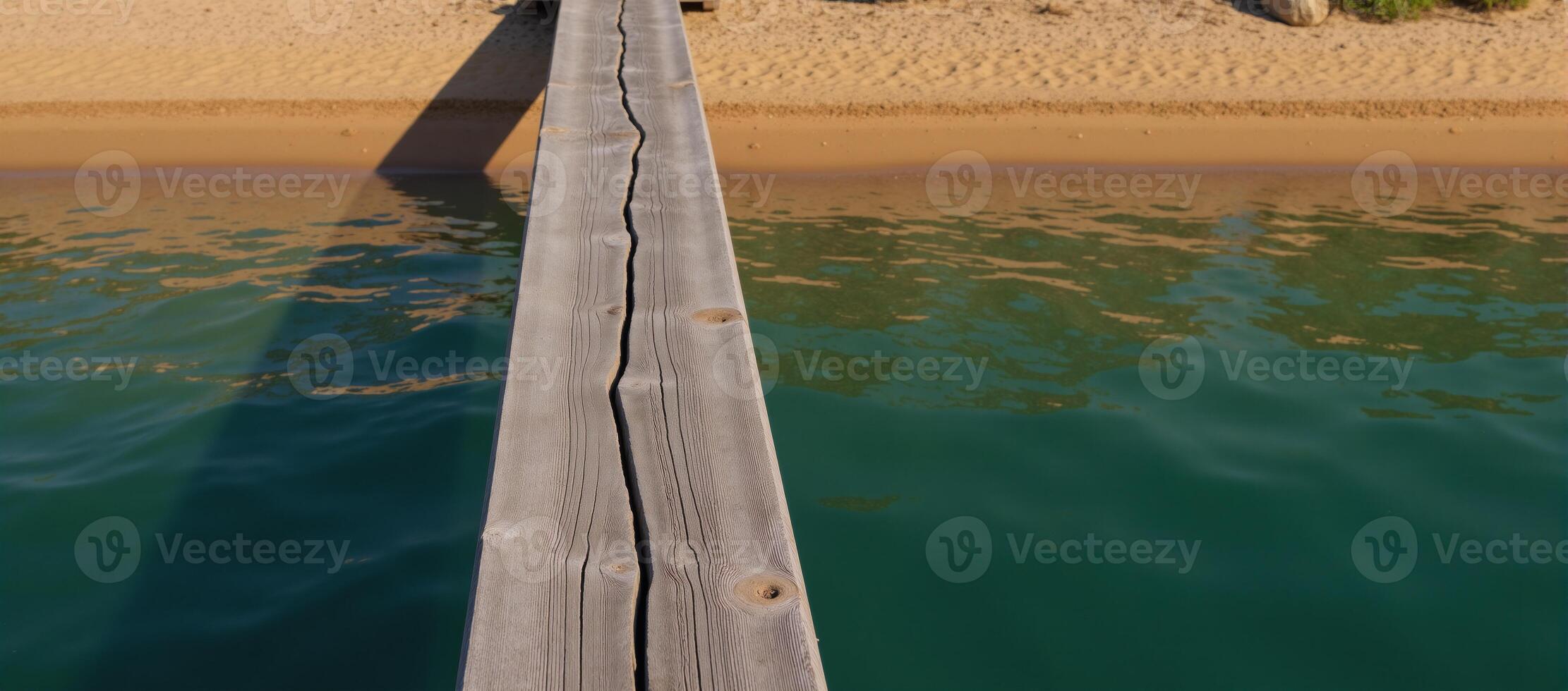 Abstract river scene water and natural elements depicted on an old wooden slab with a darkturquoise epoxy finish viewed from above over a sandy beach and riverbanks drone perspective photo