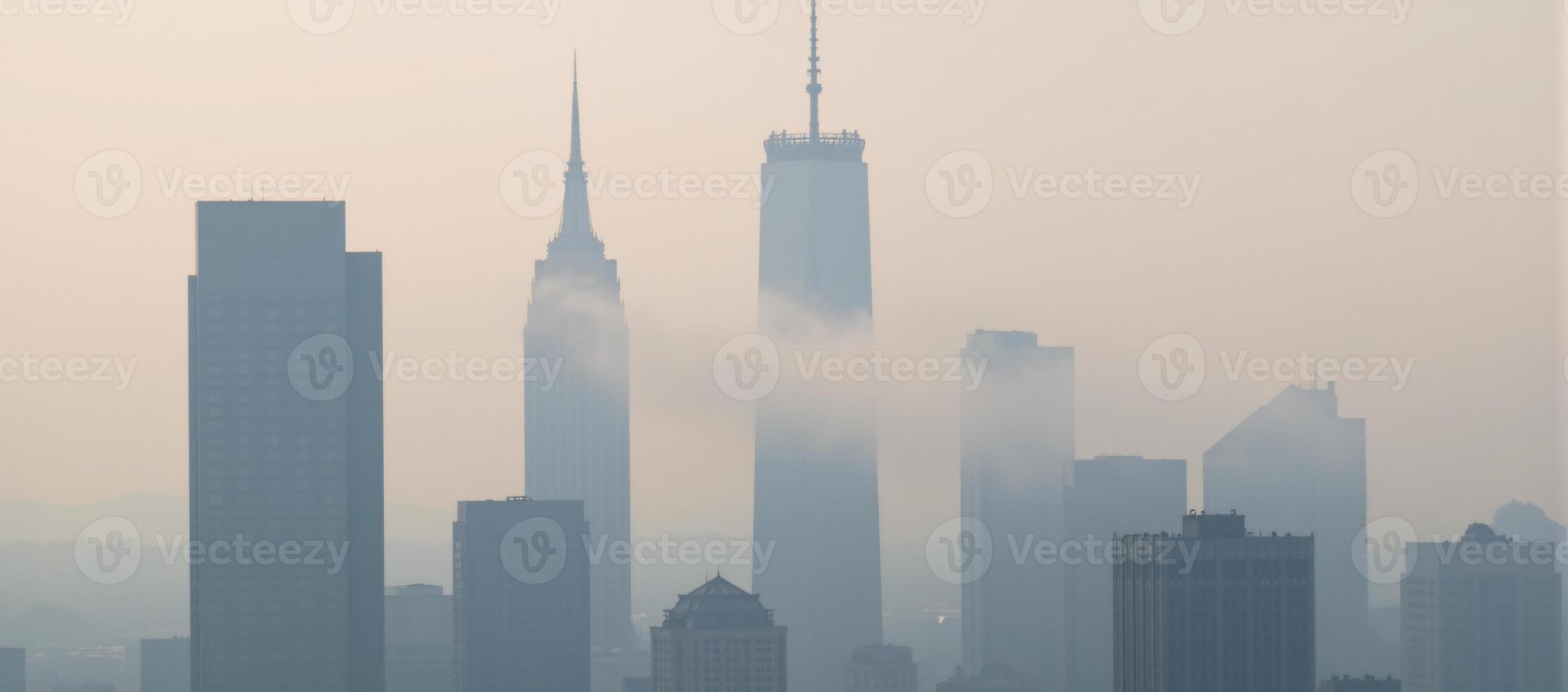 Dreamy morning fog enshrouds a city of towering buildings with delicate soft pastels and contrasts the clean architectural outlines photo
