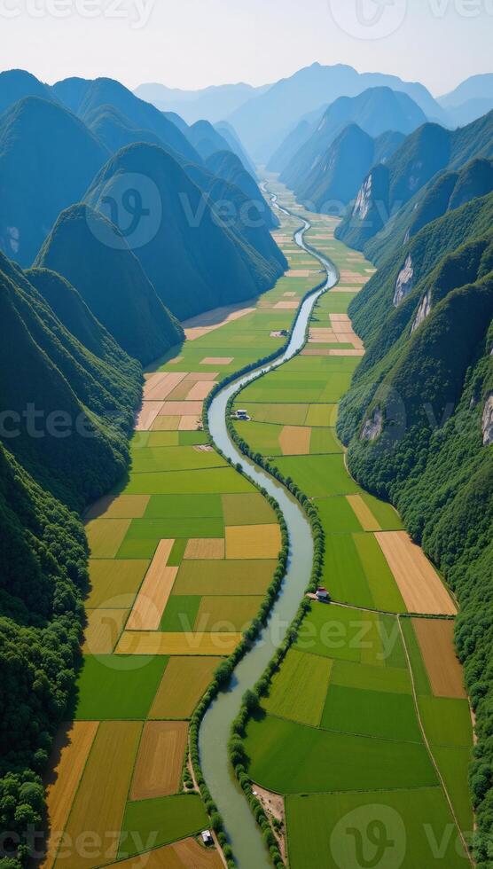 Stunning aerial view of Phong Nha Valley showcasing winding rivers rice terraces and majestic mountains photo