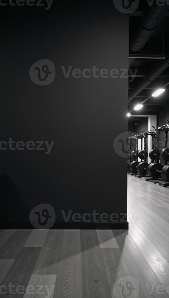 A black wall stands out against the modern woodenfloored gym interior photo
