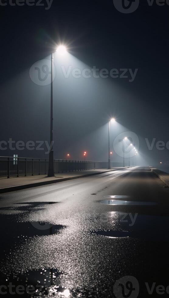 Futuristic emptied night scene Reflected street lights illuminate a damp foggy streetscape with abstract lighting and smokefilled air photo
