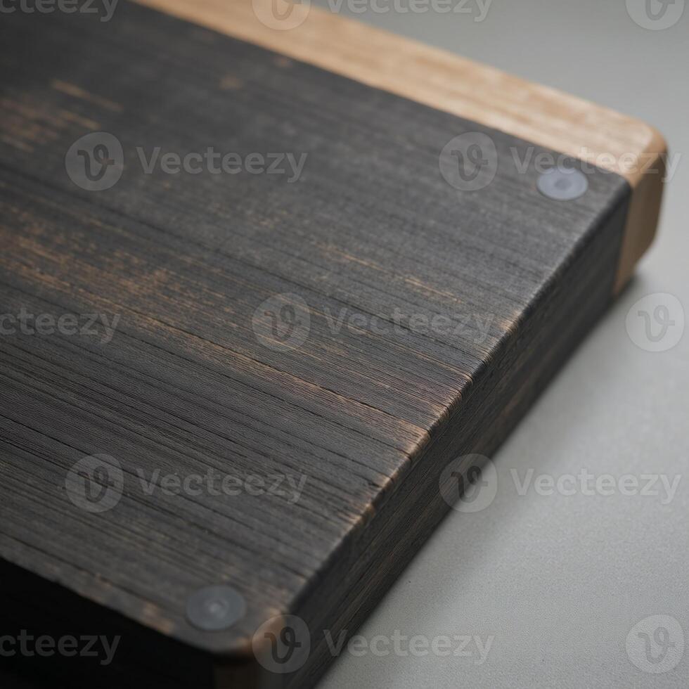 A worn textured gray chopping board with rustic appeal and noticeable scratches photo