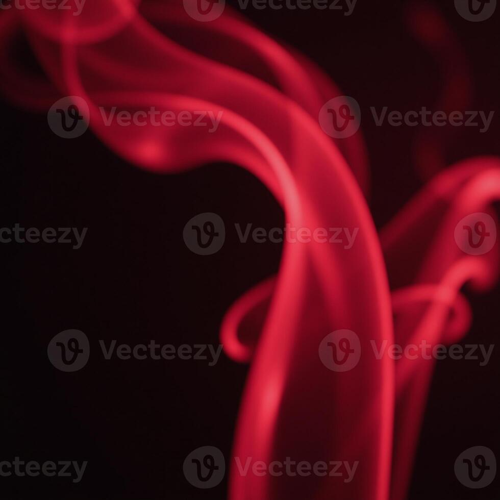 A realistic depiction of slowmoving rising red smoke and fog with an atmospheric effect photo