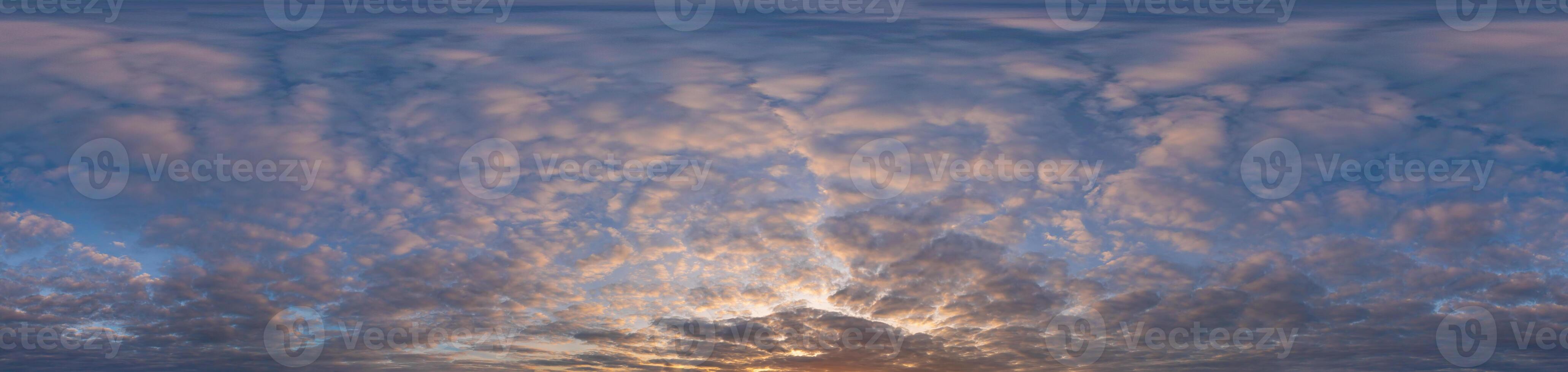 Golden sunset sky panorama Seamless spherical equirectangular 360-degree view with beautiful Stratocumulus clouds, setting sun - for use in 3D graphics as a sky dome or post-processing of drone images photo