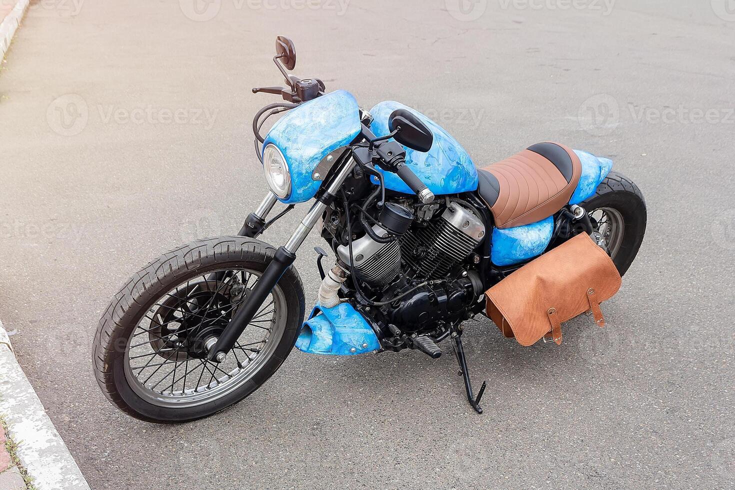 Customized motorcycle of classic design in the parking lot photo