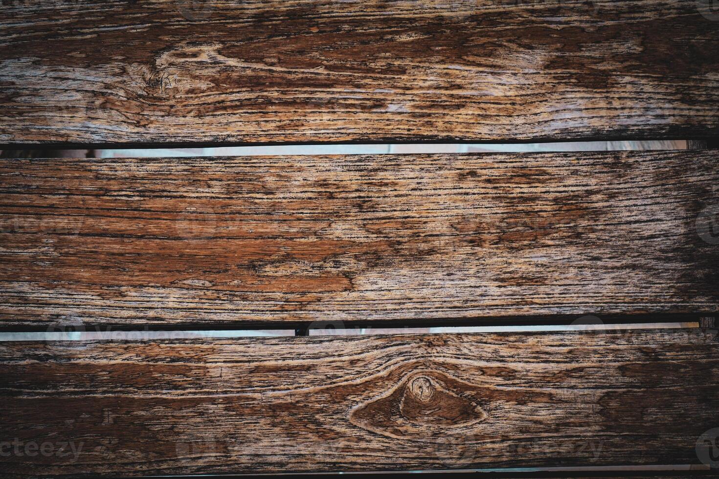 A close up of a wooden plank with a green background photo