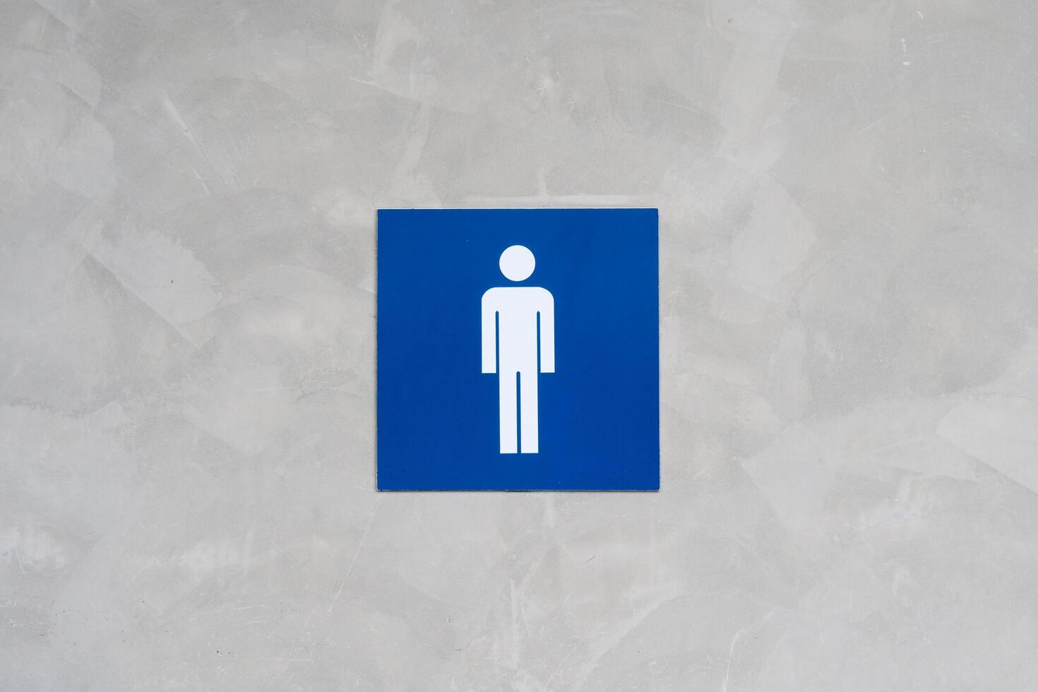 Minimalistic Blue Male Restroom Sign on Textured Gray Wall for Public Facilities and Design Concepts photo