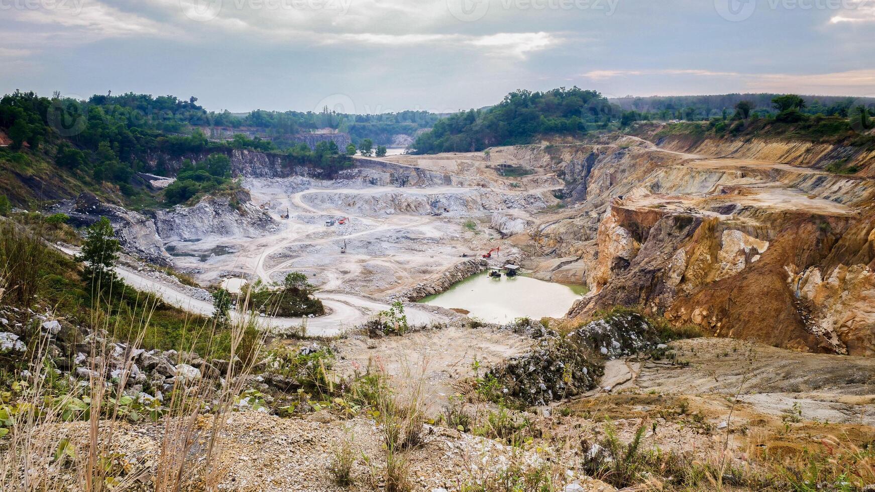 The view of a quarry with dirt and rocks photo