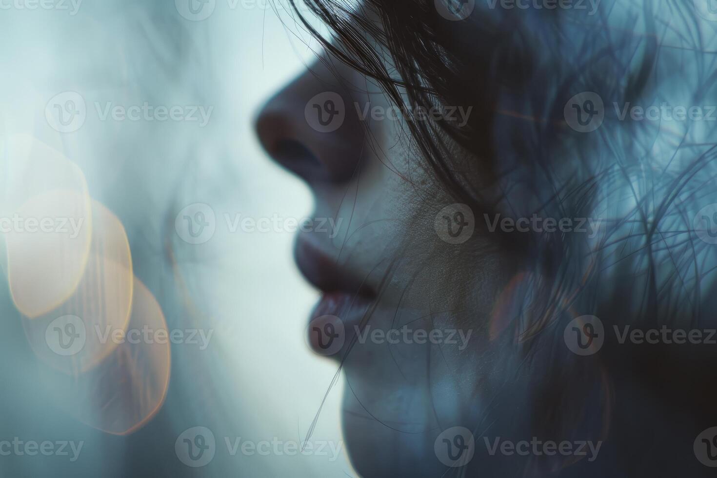 Woman posing with dreamy feather overlay effect photo