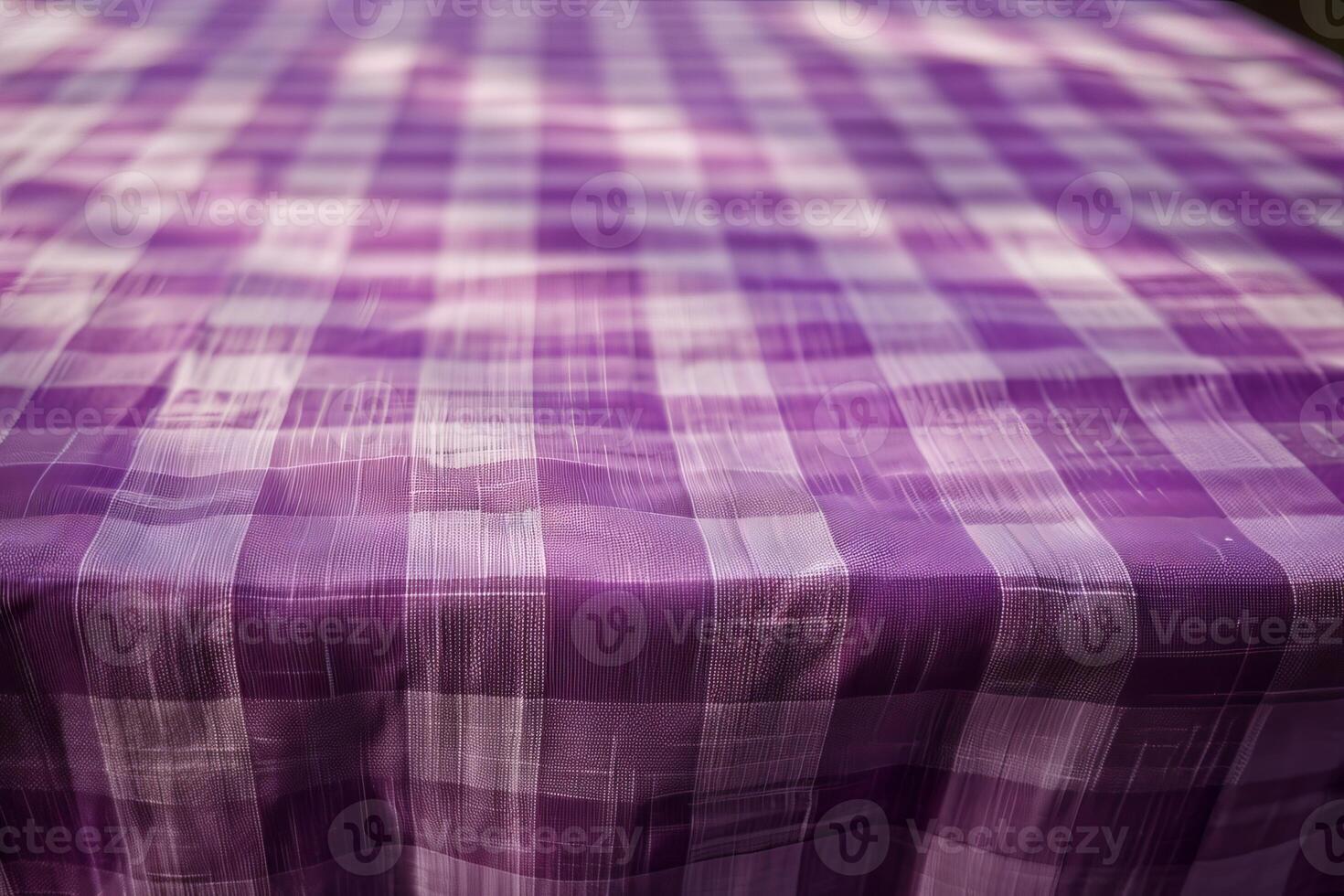 Purple gingham tablecloth covering a table in the sunlight photo