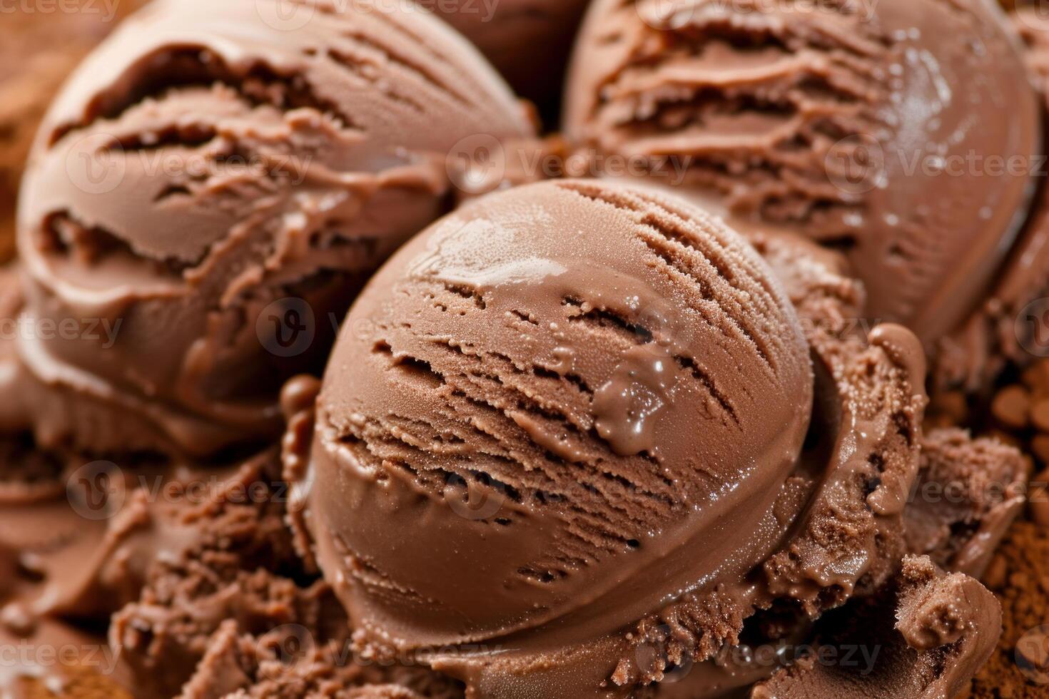 Chocolate ice cream scoops melting on chocolate flakes photo