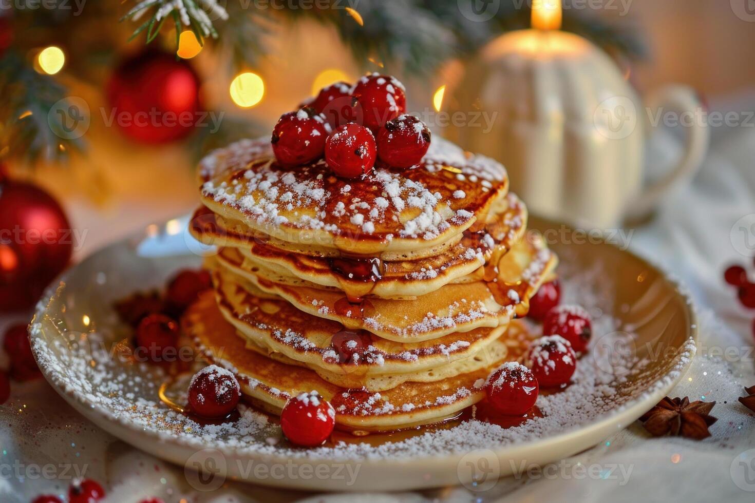 Stack of delicious pancakes with cranberry and maple syrup for christmas breakfast photo