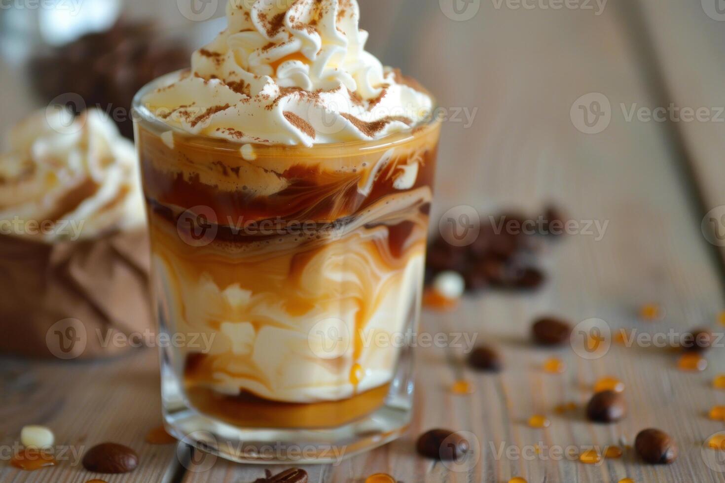 Delicious iced coffee with whipped cream and caramel drizzle on wooden table photo